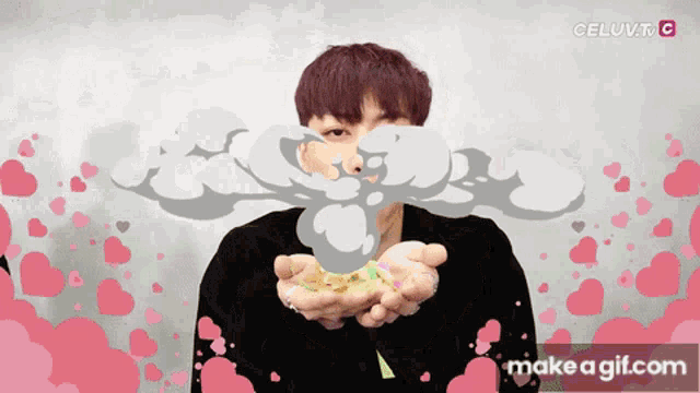 a gif of a person blowing a smoke bomb with the words celuv.tv.c on the bottom