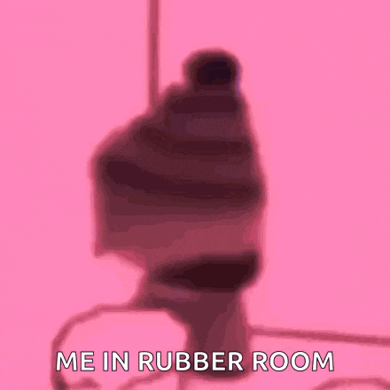 a silhouette of a person standing in a rubber room with the words `` me in rubber room '' written on it .