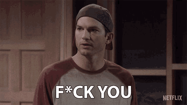 a man wearing a baseball cap and a t-shirt that says f * ck you