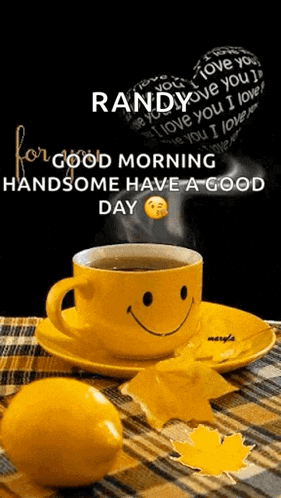 a cup of coffee with a smiley face on it is on a saucer next to a lemon and leaves .