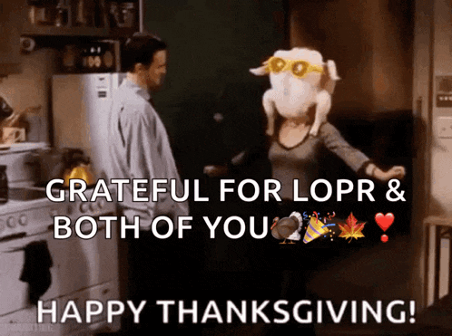 a man and a woman are dancing in a kitchen with a turkey on their head