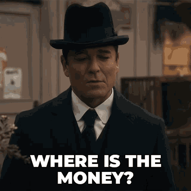 a man in a suit and hat asking where is the money