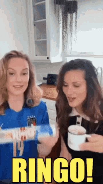 two women in a kitchen with the words ringo written in yellow