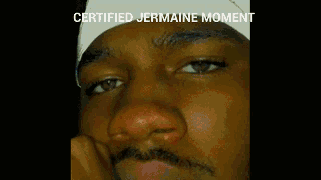 a close up of a man 's face with the words certified jermaine moment below it