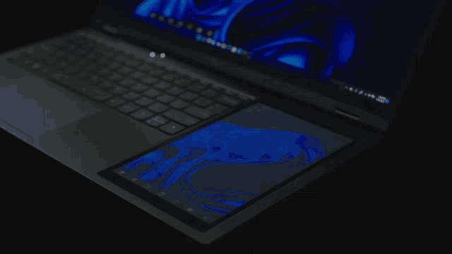 a laptop is open to a screen that says ' microsoft windows ' on it