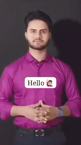 a man in a purple shirt says hello with an emoji on his chest