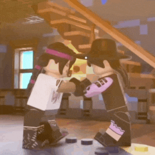 a couple of lego characters are standing next to each other in a room .