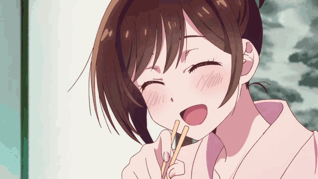 a girl with brown hair is holding chopsticks in her mouth