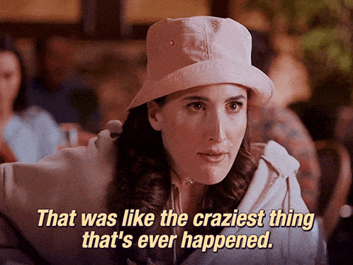a woman in a pink hat says that was like the craziest thing that ever happened