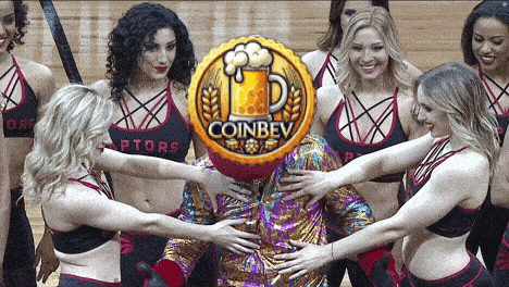 a group of cheerleaders are surrounding a man with a coin that says coinbev in front of them