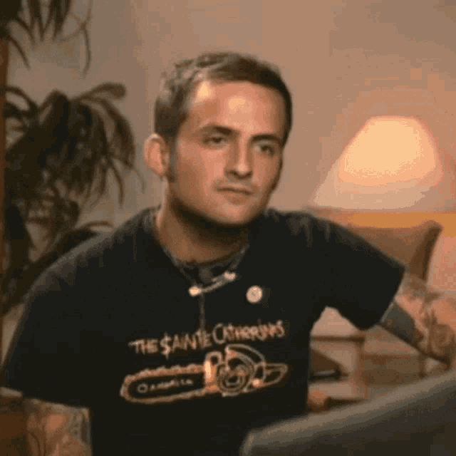 a man wearing a black shirt that says the sainte catharines