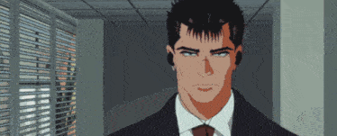 a man in a suit and tie with ear buds on his ears