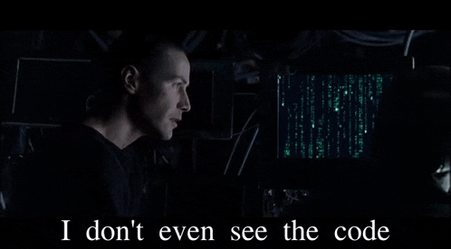 a man is sitting in front of a computer screen with the words square written below him