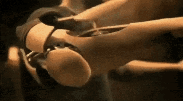 a close up of a person 's arm with a hole in the middle