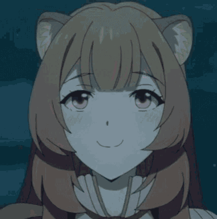 a close up of a girl 's face with a surprised look on her face .