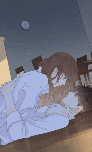 a man and a woman are laying on the floor with a clock in the background that says 7:15