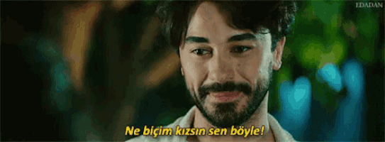 a man with a beard is crying and says ne bicim kizin sen böyle