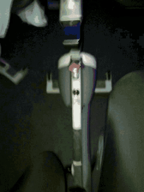 a vacuum cleaner has a red button on it