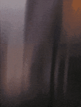 a blurry picture of a person 's face with a purple background