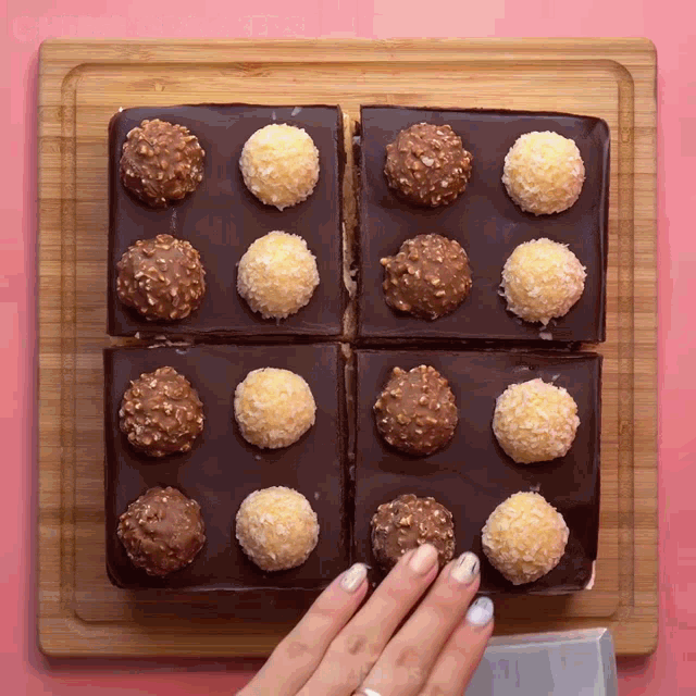 four pieces of chocolate cake with nuts on top