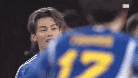 a soccer player wearing a jersey with the number 12 on it