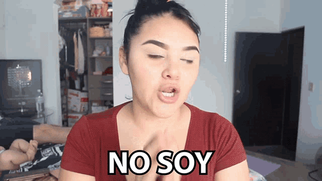 a woman in a red shirt says no soy in black letters