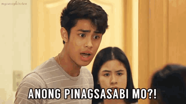 a man and a woman are standing next to each other with the man saying " anong pinagsasabi mo "
