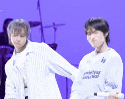 a man wearing a white shirt that says prideless beyond