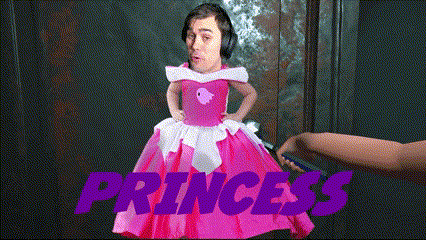 a man in a pink dress with the word princess in purple letters