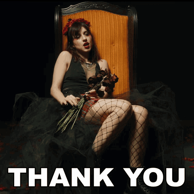 a woman is sitting in a chair holding a bouquet of flowers and the words thank you are above her