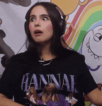 a girl wearing headphones and a hannah t-shirt