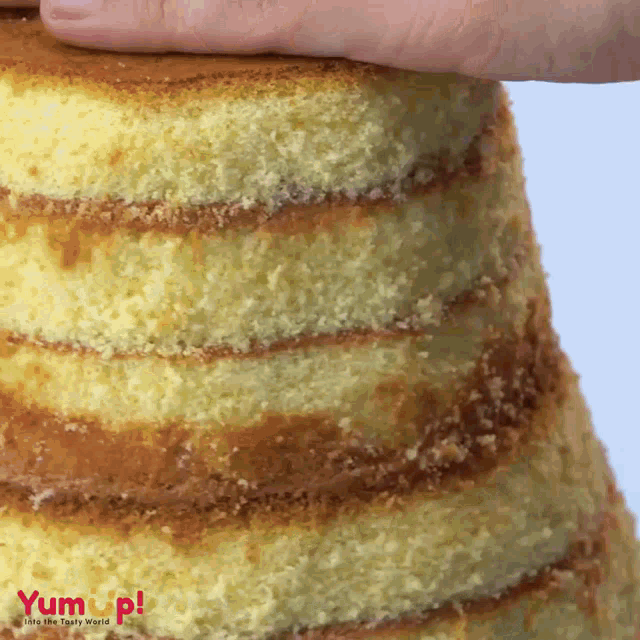 a close up of a cake that says yum up