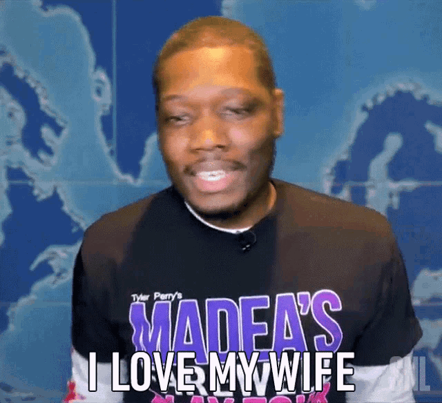 a man wearing a madea 's i love my wife t-shirt