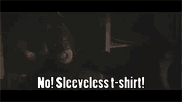 a batman says no sleeveless t-shirt in a dark room