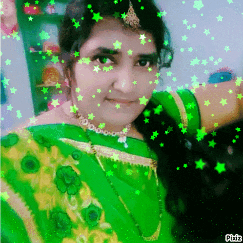 a woman in a green and yellow dress with green stars around her