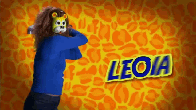 a woman wearing a lion mask is standing in front of a leopard print background and the name leona is on the bottom