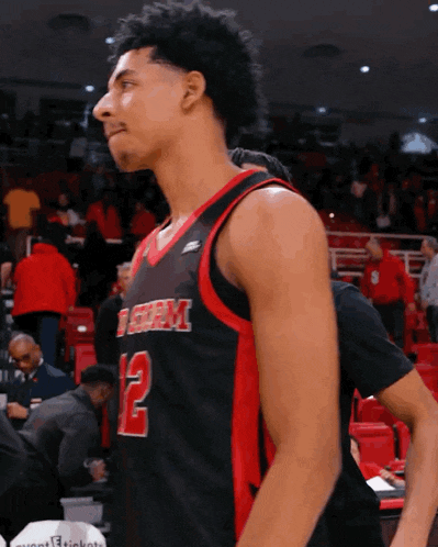 a basketball player wearing a jersey with the number 12