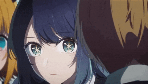 a close up of a girl with blue hair and green eyes looking at a man in a suit .