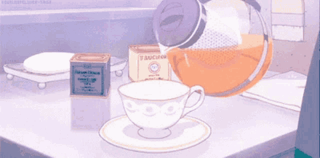 a teapot pouring tea into a cup on a saucer
