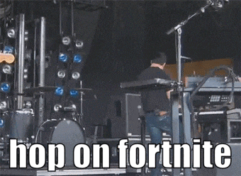 a man is playing a keyboard on a stage with the words hop on fortnite written on the bottom .