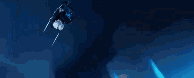 a close up of a person 's face with a blue background
