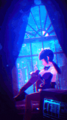 a girl is sitting in front of a window with a blue light behind her that says ' studio '