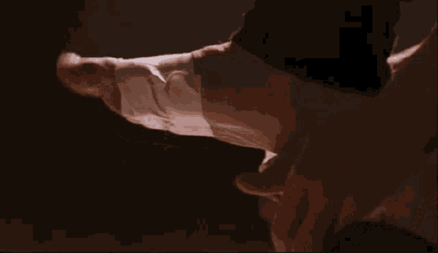 a close up of a person 's hand with a white bandage on it