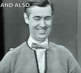 a black and white photo of a man wearing a bow tie and a sweater .