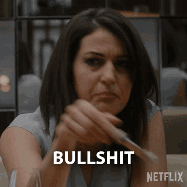 a woman holding a knife and fork with the word bullshit behind her