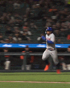 a baseball player for the new york mets is running towards the base