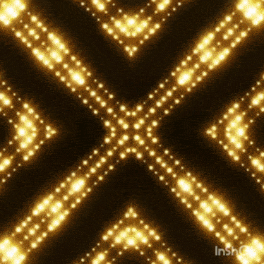 a kaleidoscope of gold lights on a dark background