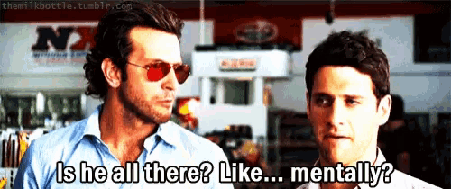 two men are standing next to each other and one of them is asking the other if he is all there like mentally