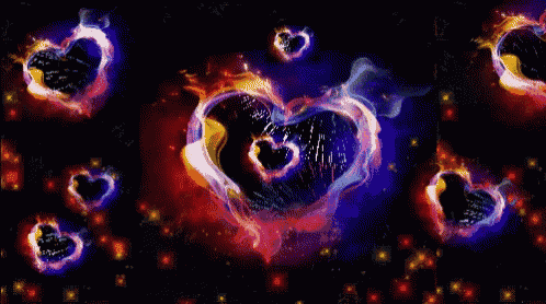 fireworks in the shape of hearts are exploding in the night sky
