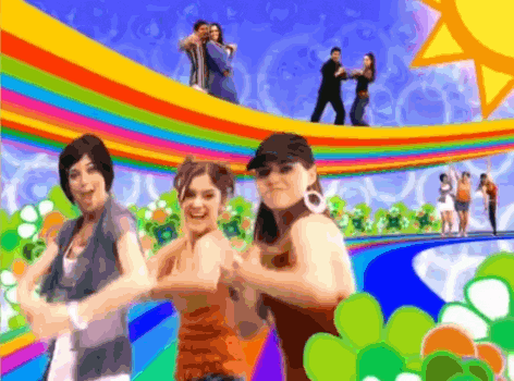 a group of people are dancing in front of a rainbow background